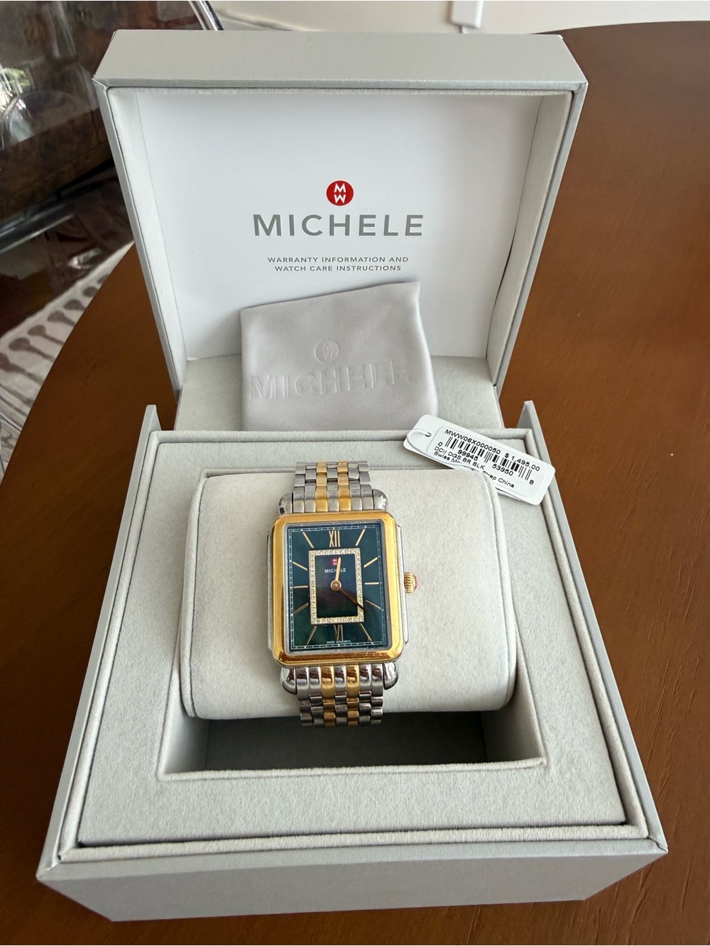 Michele Two-Tone Bracelet Watch with black opal face and diamonds detail.